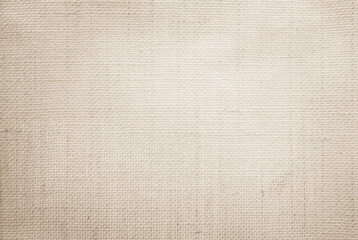 Jute hessian sackcloth canvas woven texture pattern background in light beige cream brown color...