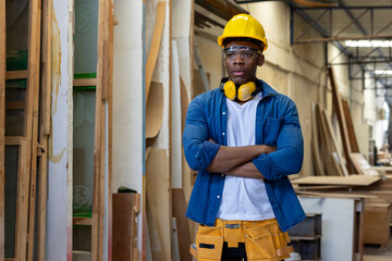 young african american male carpenter worker hold wooden plank at the carpentry workshop