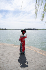 Tourist with traditional Chinese dress visit to Summer Palace in Beijing, China.