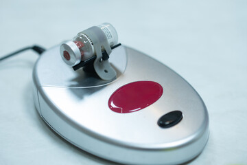 Medical equipment automatic mixer for mix small vials of liquid.