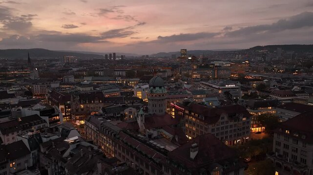 sunset sky night illumination flight over zurich city center aerial panorama 4k switzerland  
