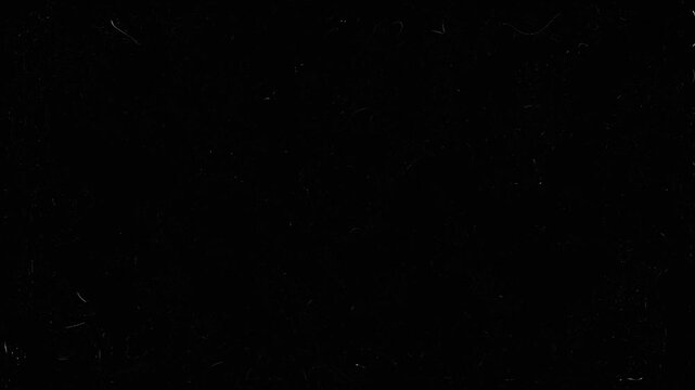 dust and grain on old damaged filmstrip surface. Dusty grunge rough vintage video on black background. Retro vintage film effect. Old movie fx film strip motion footage overlay on black background.