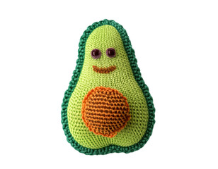 A delightful, knitted avocado toy with a charming smile and vibrant colors against a transparent background.