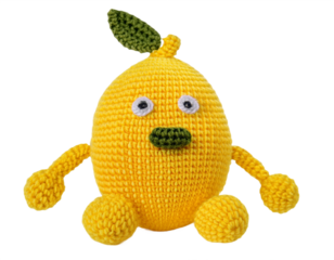 A charming yellow crochet lemon character with a leaf, perfect for whimsical designs or cheerful handmade crafts projects with its cute details, transparent background
