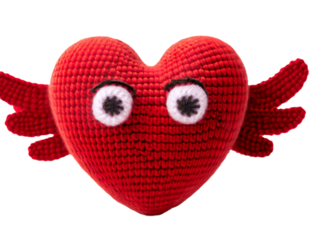 A whimsical, red crocheted heart with wings and googly eyes floats against a clean transparent background, perfect for love or craft themes.