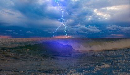 Beautiful landscape with lightning over the stormy sea 