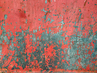 rusty scratched metal surface with red peeling paint. industrial background. closeup view.