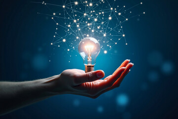 Hand holding a glowing lightbulb connected to an intricate digital network, symbolizing ideas and innovation