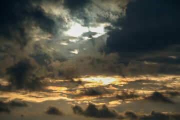 The sunlight looks like an aurora, illuminating the expanse of mountains. This photo was taken...