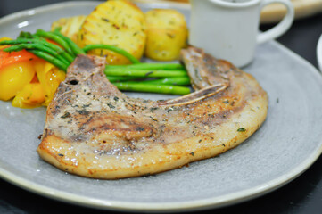 pork steak or grilled pork and salad or pork chop