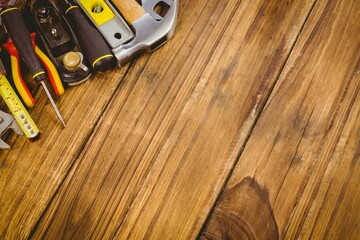 Hand tools are lying on workbench in flat vector illustration featuring hammer, pliers, copy space