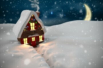 Flat red two-story house is sitting in snowy field at night, glowing windows and string lights