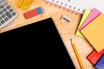 Flat design illustration is showing desk with blank board, calculator, ruler, notebook, stationery