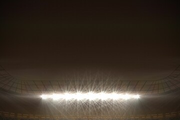 Large football stadium with spotlights at night