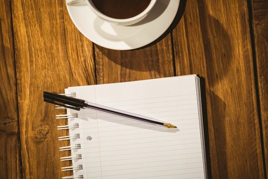 Fototapeta Desk with coffee and notepad