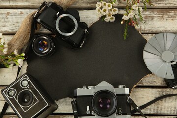 Paper piece and camera on table