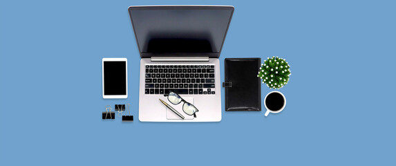 Top view desk office workspace with equipment on empty copy space for freelance working productive workplace area or home office flat lay background.