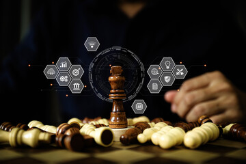 King chess on falling chess with business strategy plan icons for leadership or wining challenge and team player and risk management or human resource or strategic planning.