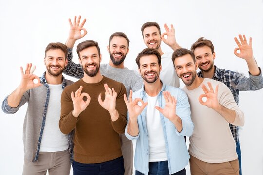 group of men making OK hand signs positive vibe studio setting clean white background smiling faces