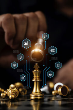 Hand chooses king on chess falling with business strategy plan icons for leadership or wining challenge and team player and risk management or human resource or strategic planning.