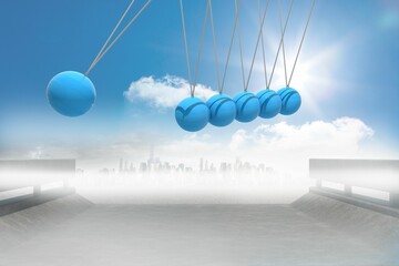 Newtons cradle above city