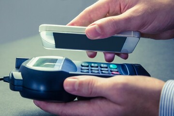 Man using smartphone to express pay