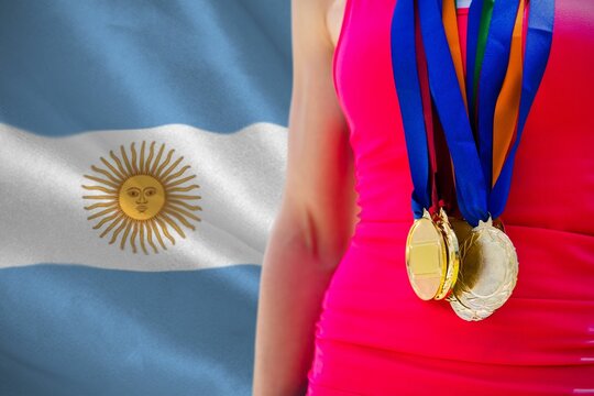 Naklejki Midsection of medalist against Argentinian Flag