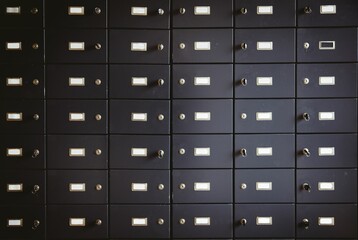 Flat design showing metal safe deposit box fronts in secure vault with locks and hanging keys