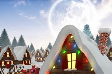 Cute christmas village under full moon