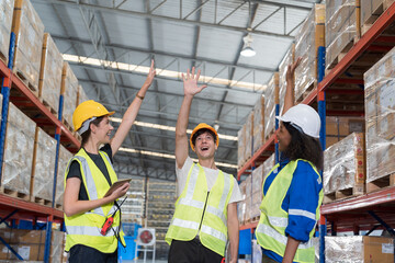Group of warehouse worker join hands together, meeting, Work completed successfully. Collaboration...