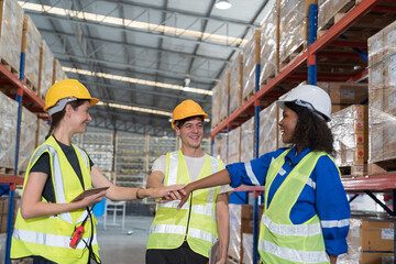 Group of warehouse worker join hands together, meeting, Work completed successfully. Collaboration...