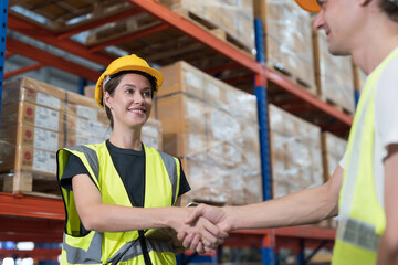 Group of warehouse worker join hands together, meeting, Work completed successfully. Collaboration...