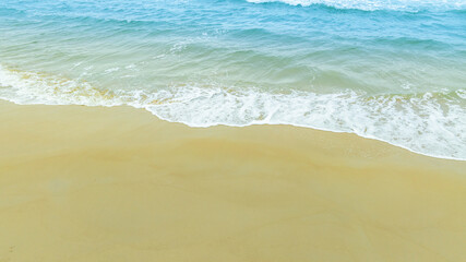 Nature of the beach and sea Summer with sunshine, sandy beaches, clear blue waters sparkling against the blue sky. On an island with good ecology and environment Background for summer vacation