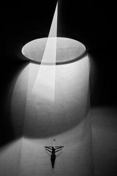 silhouette of Jesus walking in a tunnel