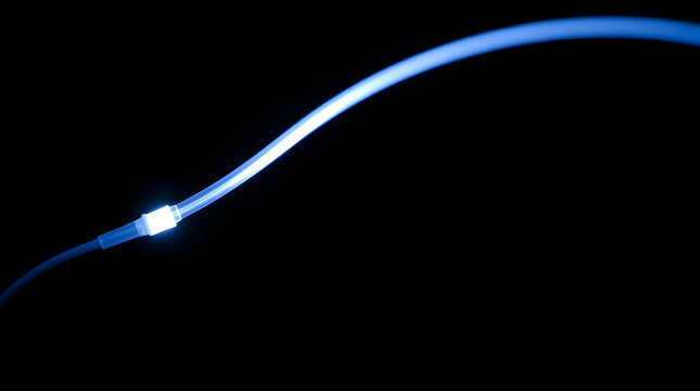 A single fiber optic strand glows intensely, arcing on a black background, showcasing a bioluminescent tip - Powered by Adobe