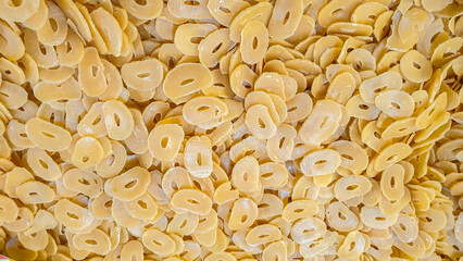 Abundance of Dried Garlic Slices, Close-Up View Showcasing Food Ingredient Preparation