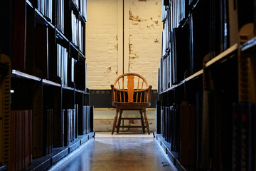 chair between the bookshelf