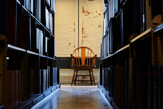 chair between the bookshelf