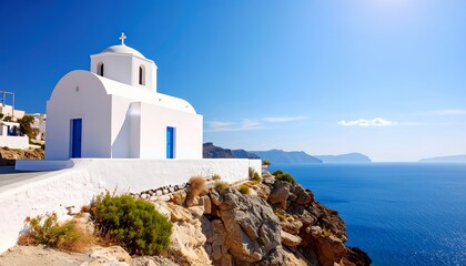 White Chapel on Cliff overlooking Aegean Sea.