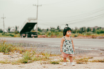 Children's journey baby girl explores life with family a rural setting