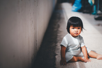 Family life asian baby girl a sidewalk candid moment urban environment playful concept
