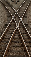 Fototapeta premium A close up view of a railroad switch with gravel and wooden ties in an outdoor environment