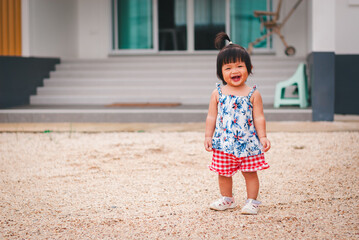 Joyful baby girl playing outside family time urban environment capturing life moments