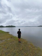 Woman Looking at a Beautiful Lake