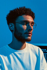 Man in Glasses with Blue Lighting