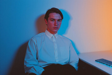 Man Sitting with Color Lighting