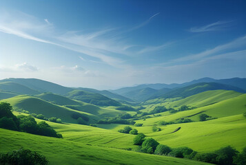 Obraz premium Vibrant Landscape of Lush Green Rolling Hills Under a Blue Sky
