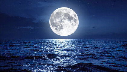 Full moon shining brightly over calm blue ocean water at night with peaceful sky