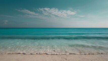 Serene coastal landscape with turquoise ocean waves and sandy beach under clear sky