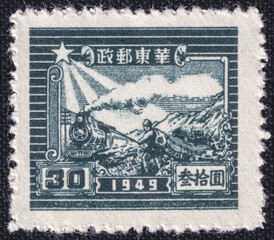 Steam locomotive, truck and man on a 1949 China vintage postage stamp. Steam Train and Post Runner...